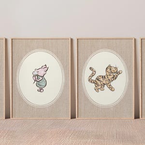 May include: Four framed wall art prints featuring classic illustrations of Winnie the Pooh, Piglet, Tigger, and Eeyore. Each character is centred within an oval border on a textured, light beige background, enclosed in simple light wood frames.