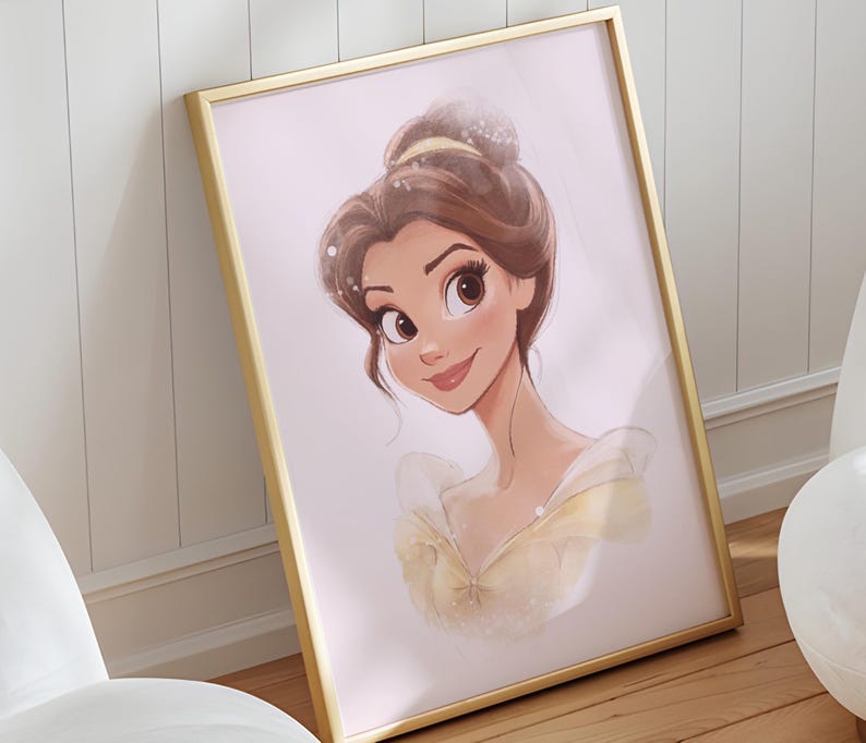 May include: A framed print of Belle from Disney's Beauty and the Beast. The print features a cartoon illustration of Belle with brown hair and a yellow dress. The background is a light pink colour.
