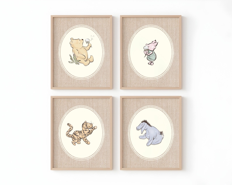 May include: A set of four framed wall art prints featuring illustrations of Winnie the Pooh, Piglet, Tigger, and Eeyore. Each print is housed in a light wood frame with a textured mount and an oval border surrounding the character artwork.