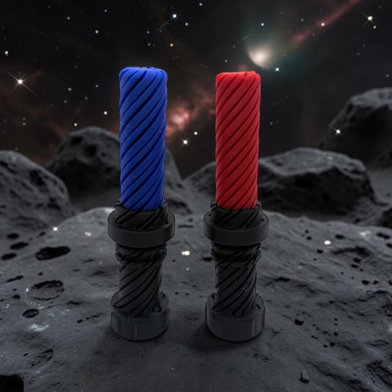 May include: Two cylindrical objects with a spiral design, one blue and one red, sit on a dark surface. The objects have a black base and a textured, twisted top. The background features a starry night sky.