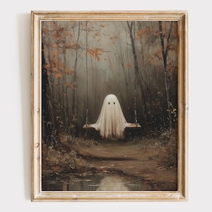 May include: A framed painting depicts a ghost on a swing in a misty forest. The ghost is draped in a white sheet with two black eyes. The artwork has a muted color palette of browns, greens, and grays, creating a spooky, atmospheric scene.