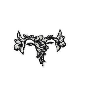 May include: Black and white embroidered patch of a stylized uterus with flowers.