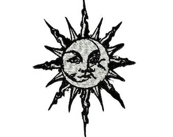 May include: Black and white illustration of a sun with a face and a crescent moon shape in the centre.