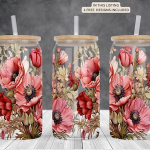 May include: Three clear glass tumblers with bamboo lids and straws. Each tumbler features a floral design with red poppies and green foliage.
