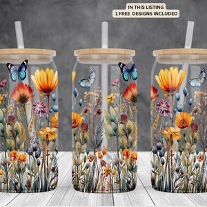 May include: Three clear glass tumblers with bamboo lids and straws. Each tumbler features a colorful floral design with butterflies and a watercolor effect.