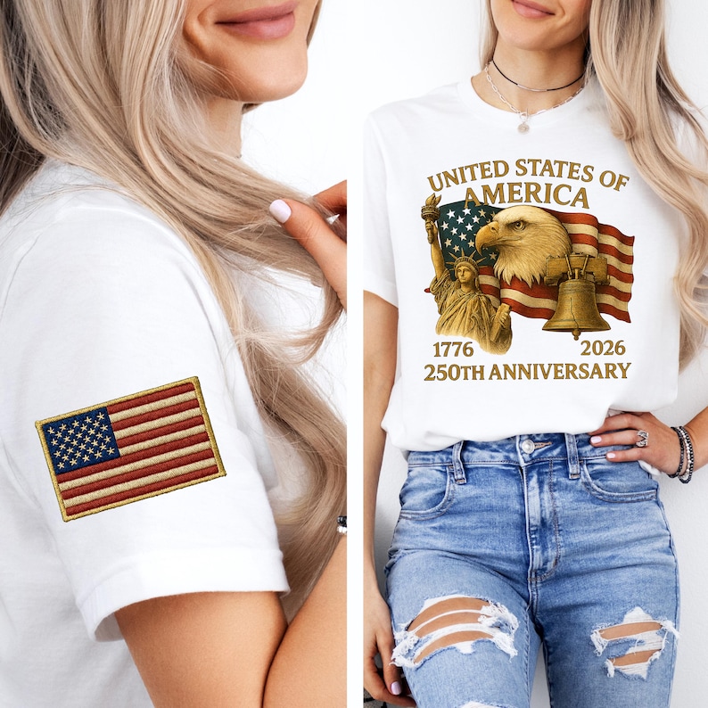 Puede incluir: Camiseta blanca con un dise&ntilde;o que celebra el 250 aniversario de los Estados Unidos de Am&eacute;rica. El dise&ntilde;o incluye un &aacute;guila, la Estatua de la Libertad, una bandera y una campana. Un parche bordado de la bandera americana est&aacute; en la manga.