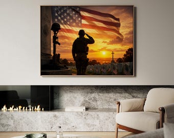 May include: Framed artwork depicting a soldier saluting the American flag at sunset. The image includes a war memorial with a helmet, rifle, and boots. The background shows a cemetery with American flags and a cross, set against a vibrant orange and yellow sky.