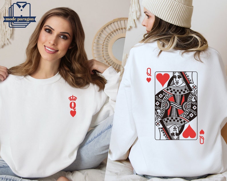 May include: White sweatshirt with a red queen of hearts playing card graphic on the back and a small red queen of hearts graphic on the front.