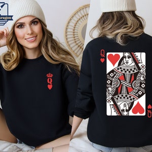 May include: Black sweatshirt with a red Queen of Hearts playing card design on the back and a small red Queen of Hearts symbol on the front.