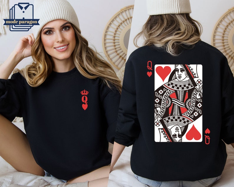 May include: Black sweatshirt with a red Queen of Hearts playing card design on the back and a small red Queen of Hearts symbol on the front.