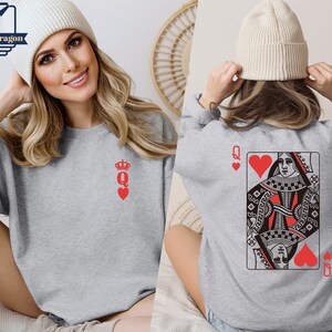 May include: Gray sweatshirt with a red queen of hearts playing card design on the back and a small red queen of hearts design on the front.