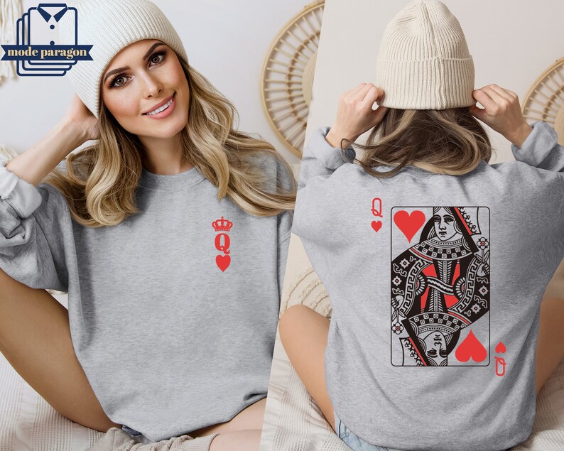 May include: Gray sweatshirt with a red queen of hearts playing card design on the back and a small red queen of hearts design on the front.