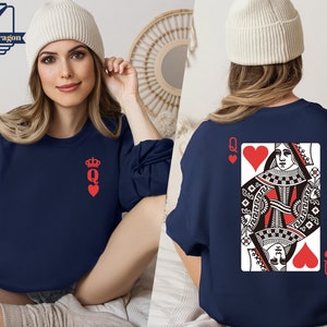 May include: A navy blue sweatshirt with a red queen of hearts playing card design on the back and a smaller red queen of hearts design on the front.