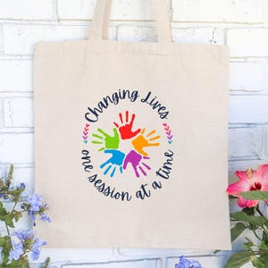 Changing Lives One Session at a Time Cotton Canvas Tote Bag - Perfect Accessory or Gift for Therapist/Educator/ABA Professional