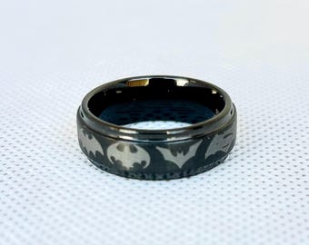 Personalized  superhero bat inspired ring, inside and outside wrap around various symbols through the years.