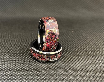 Opal inlay glow ring with aluminum shavings on black zirconia ceramic core. Free inside laser engraved