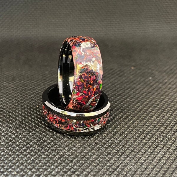 Opal inlay glow ring with aluminum shavings on black zirconia ceramic core. Free inside laser engraved