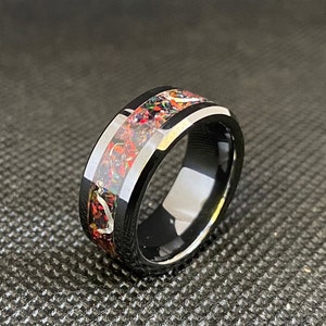 Opal inlay glow ring with aluminum shavings on black zirconia ceramic core. Free inside laser engraved