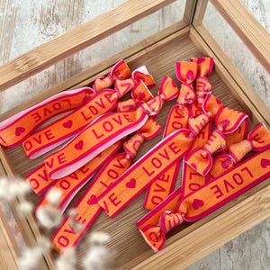 Gummi „LOVE“ Armband - Festival, pink orange Liebe