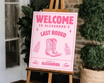 May include: Pink welcome sign with the text "Welcome to Alexandra's Last Rodeo" and a pair of cowboy boots, two bottles of tequila, and two cowboy hats. The sign is on an easel and is 16x20 inches.