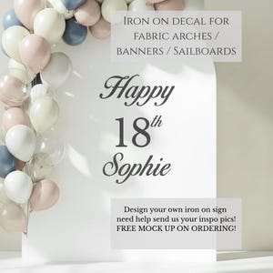 May include: A white arched display board featuring the black text Happy 18th Sophie, decorated with a cluster of balloons in shades of dusty rose, slate blue, cream, and white. The board includes text about iron on decals for fabric arches.