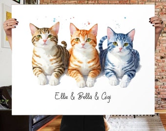 May include: A watercolor print featuring three cats: a brown tabby, an orange tabby, and a blue tabby. The print includes the names "Ellie & Bella & Gigi" in a script font. The cats are depicted lying down on a white background.