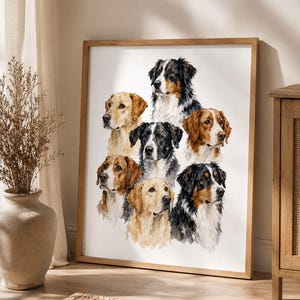 May include: A framed wall art print featuring a watercolor illustration of seven dogs of various breeds and coat colors, including golden, black, white, and brown markings, arranged in a cluster against a plain white background.