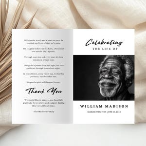 May include: Black and white photo of a man smiling. The text "Celebrating the Life of William Madison March 30th, 1943 - June 10, 2024" is below the photo. The text "Thank You" is on the left side of the image with the text "The Madison Family" below it.