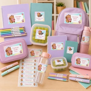 May include: A collection of school supplies including a lavender backpack, notebooks, pencil cases, water bottles, and food containers, all featuring personalized stickers with a capybara illustration and the text Charlotte Smith Grade 4.