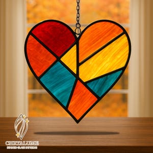 May include: A stained glass heart with a black border, suspended by a chain. The heart is divided into geometric sections of red, orange, yellow, and teal. The logo "CHRYALUME STAINED GLASS PATTERNS" is at the bottom.