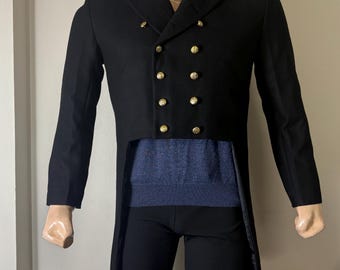 May include: A black tailcoat with a double-breasted closure and gold buttons. The coat has a long, flowing tail and is made of a smooth, luxurious fabric.