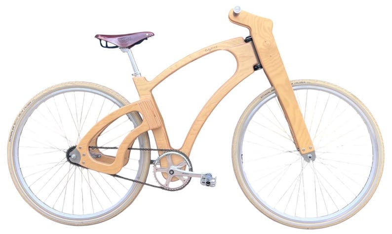May include: A wooden bicycle with a unique frame design. The bike features a light brown wooden frame, a brown leather seat, and cream-colored tires. The wheels have silver spokes and rims. The bicycle is designed for a smooth ride.
