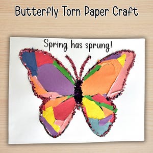 May include: A colorful butterfly made from torn paper pieces, with a glitter outline. The artwork features a variety of colors, including red, orange, yellow, purple, and blue. The text "Spring has sprung!" is written above the butterfly.