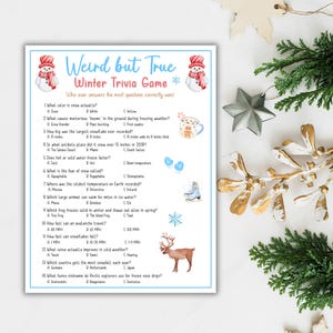 May include: A printed winter trivia game with the title "Weird but True." The game features questions about snow, freezing weather, and winter facts. Decorative elements include a snowman, snowflakes, and a reindeer.