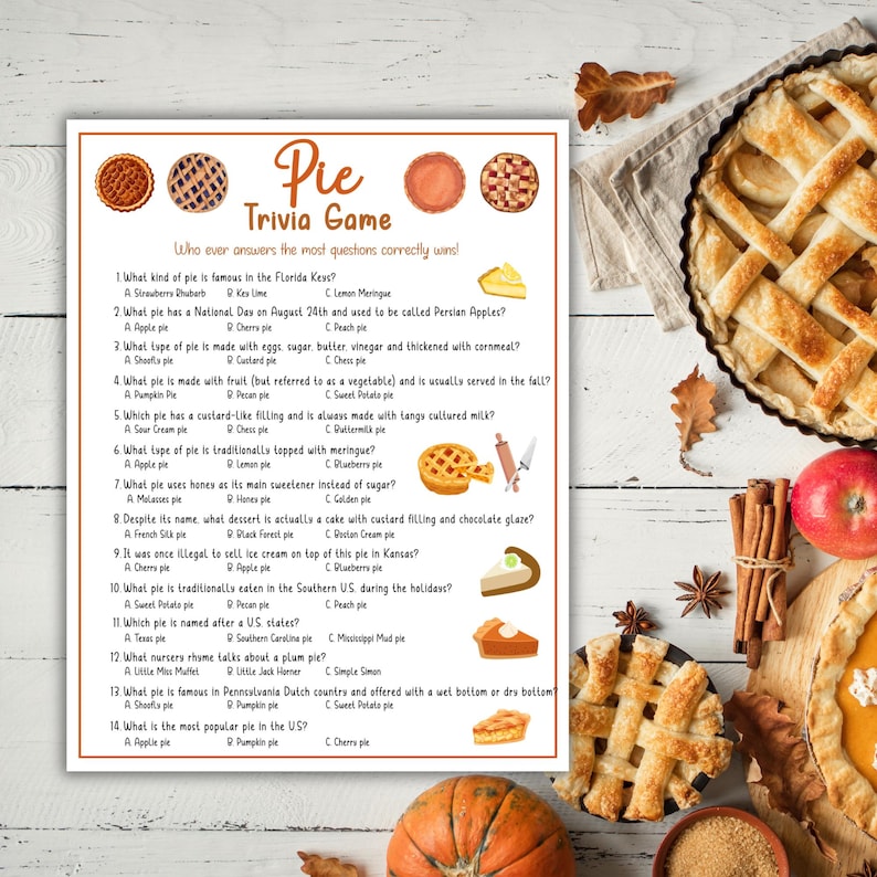Op de afbeelding: Een pie trivia-spel met verschillende pie-illustraties en een gebakken pie. Het spel bevat vragen over verschillende soorten pies, zoals appel, pompoen en zoete aardappel. De tekst op het spelbord luidt "Pie Trivia Game."
