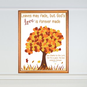 May include: Framed art print featuring a tree with a colorful autumn-themed canopy. The artwork includes the text "Leaves may fade, but God's Love is forever made" and a Bible verse. The frame is a warm brown color.