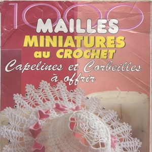 May include: A magazine cover showing a white crocheted hat with a floral design and pink ribbon. The text on the cover reads "MAILLES MINIATURES au CROCHET Capelines et Corbeilles à offrir."