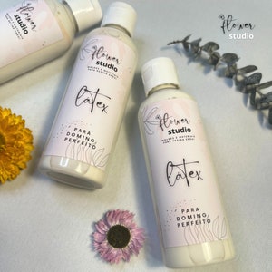 May include: Three white bottles with a pink and white label. The label says "Flower Studio" and "Latex for perfect doming".