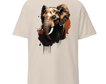 May include: A beige t-shirt with a graphic of an elephant's head in brown and black with a splash of orange paint.