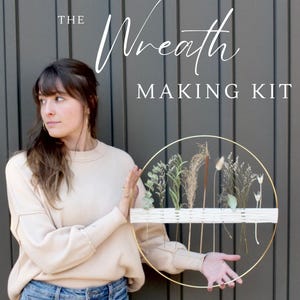 May include: A wreath making kit featuring a gold metal ring and a white wooden base holding dried flowers and greenery. The text "THE Wreath MAKING KIT" is at the top, with "For the Floral Enthusiast, Crafters, and DIY Gals!" at the bottom.