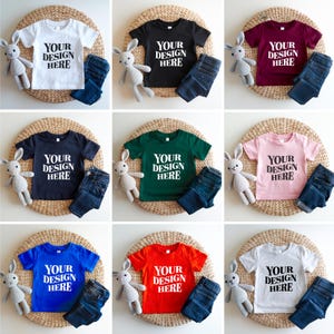 Showcase your designs with this premium Bella Canvas 3001T kids mockup bundle, featuring 16 high-resolution flat lay mockups in a wide range of colors. These mockups are perfect for designers, Etsy sellers, and print-on-demand (POD) businesses looking to professionally present their youth apparel designs. Each flat lay mockup displays the Bella Canvas 3001T toddler/youth tee in a clear, minimalistic overhead style, allowing your design to be the focus. These are JPG-only files.