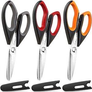 May include: Three pairs of multi-purpose kitchen shears with stainless steel blades and ergonomic handles in black, red, and orange. Each pair features a serrated section near the pivot and comes with a matching black protective blade cover.