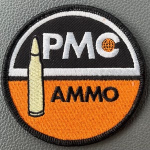 PMC Ammo Firearms vintage style patch. Can be sewn or ironed on.