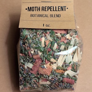 May include: A clear plastic bag filled with a mixture of dried herbs and wood chips. The bag has a brown paper label that reads "MOTH REPELLENT - BOTANICAL BLEND 1 oz."