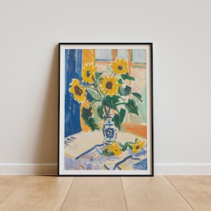May include: A painting of a vase with sunflowers in a blue and white pattern. The vase is on a table with a white tablecloth. The sunflowers are yellow with green leaves and stems. The background is a blue and orange wall with a window.