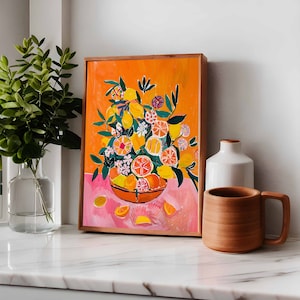 May include: A framed illustration of a bowl filled with lemons, limes, and oranges. The bowl is surrounded by green leaves and pink flowers. The background is a bright orange color.