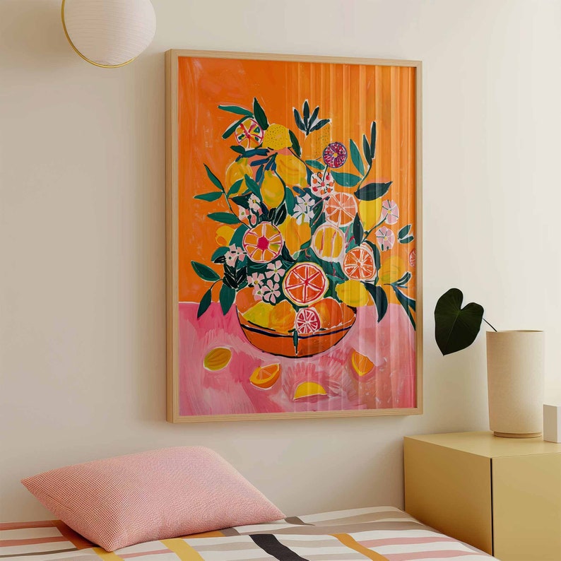 May include: A painting of a bowl filled with lemons, limes, and flowers. The bowl is on a pink and orange background with a striped pattern. The painting is framed in a wooden frame.