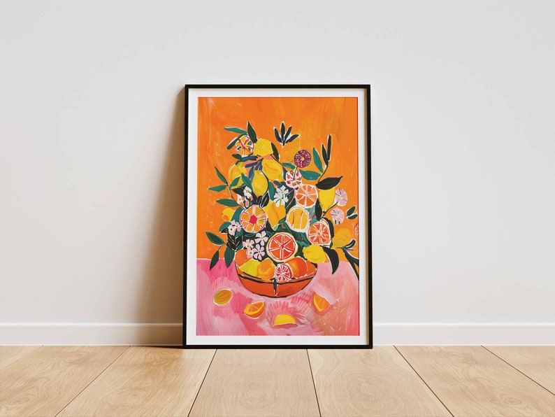 May include: A framed print of a painting featuring a bowl overflowing with lemons, oranges, and flowers. The bowl is on a pink surface with a bright orange background.