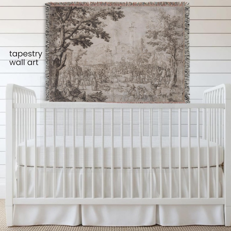 May include: A woven tapestry wall art featuring a detailed monochromatic landscape scene with trees, buildings, and numerous figures. The rectangular textile has a fringed edge and displays a historical illustration in shades of brown and beige.
