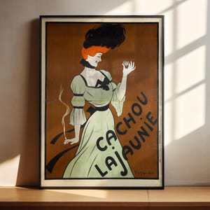 May include: A vintage poster advertising "Cacao La Jaune" with a woman in a green dress holding a small object. The poster has a brown background with black and white text.